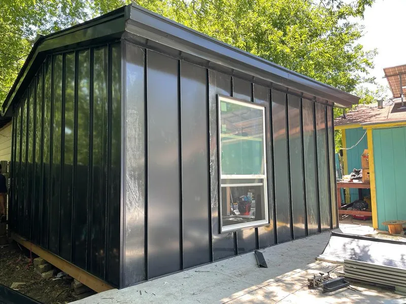 Black standing seam metal wall panels for Roof Inspection in Oswego