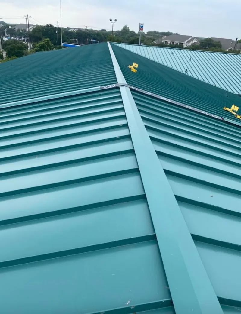 Green commercial metal roof ridge and valley for Metal Roof Repair in Oswego