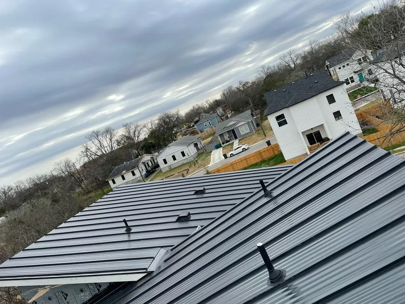 Standing seam metal roof panels with vents for Skylight Repair in Oswego